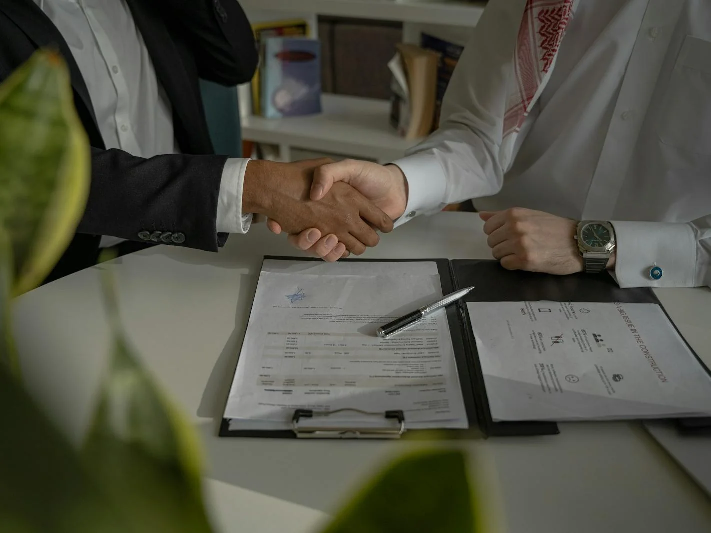 Advisor and client shaking hands during a personalized tax consultation